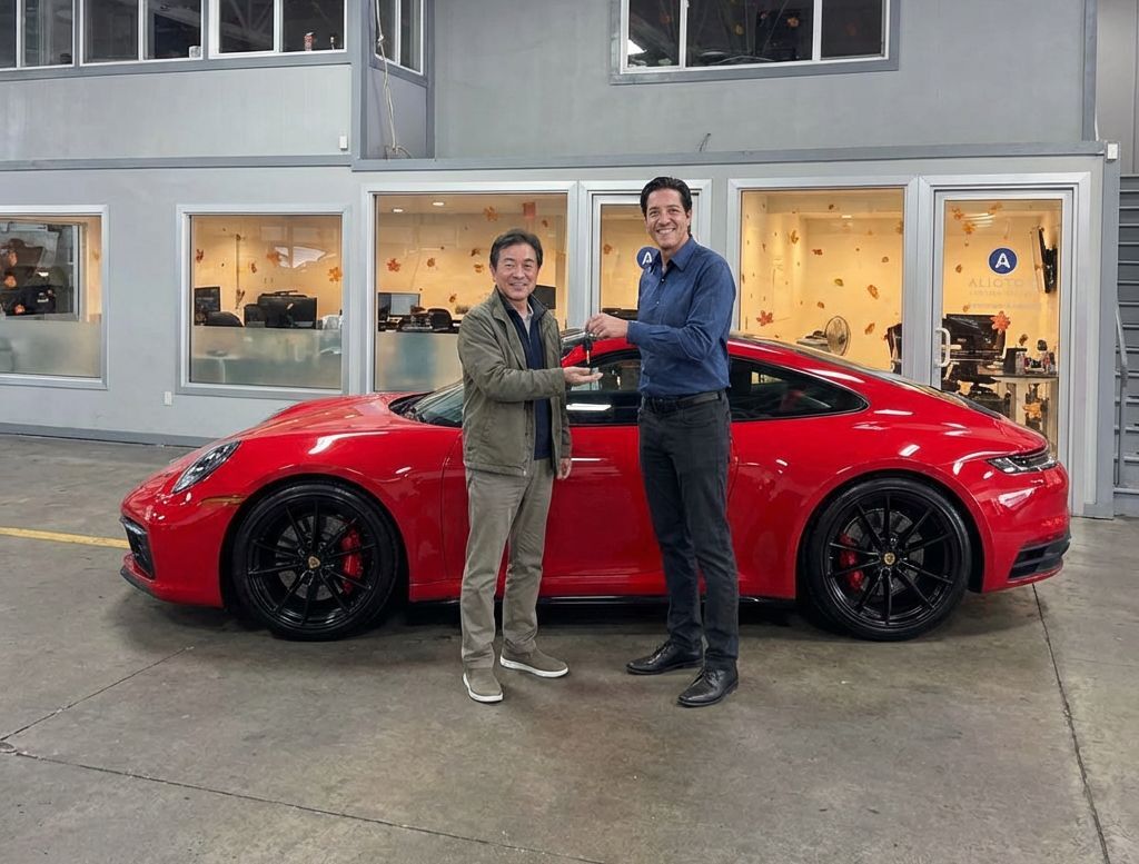 Chris Alioto handing keys to a customer after auto body repair to his Porsche at Alioto’s Folsom Street Location (1) Chris-Alioto-handing-keys-to-a-customer-after-auto-body-repair-to-his-Porsche-at-Aliotos-Folsom-Street-Location