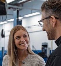 Customer with auto body technician smiling at Alioto’s Auto Body Customer-with-auto-body-technician-smiling-at-Aliotos-Auto-Body