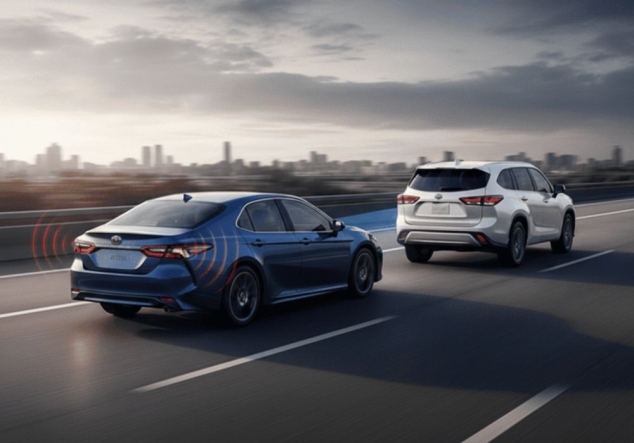 blue and white toyota cars on highway showing ADAS working Alioto’s Auto Body blue-and-white-toyota-cars-on-highway-showing-ADAS-working-Aliotos-Auto-Body.