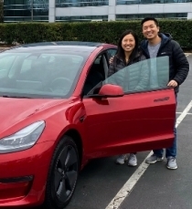 Tesla-with-customers-smiling-after-repair-at-Aliotos-Auto-Body-San-Francisco
