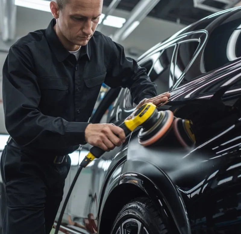 auto-tech-buffing-paint-on-car-at-Aliotos-Auto-Body